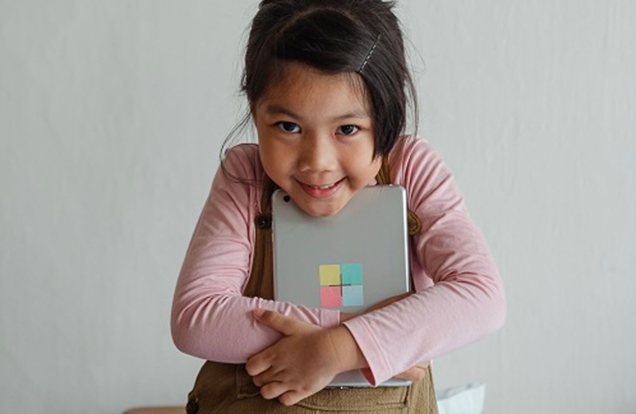 A girl holding a tablet
