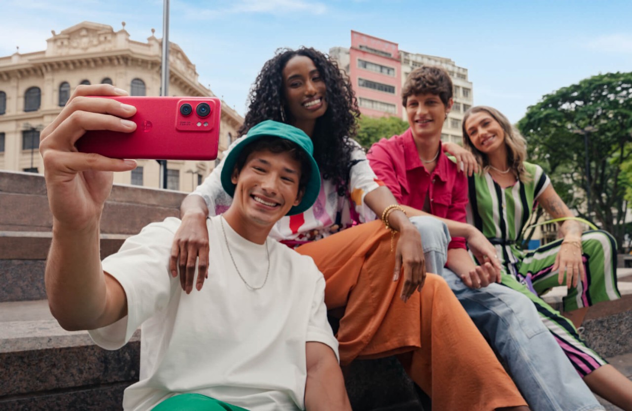 Four friends posing for a selfie using their Motorola Edge 40 phone