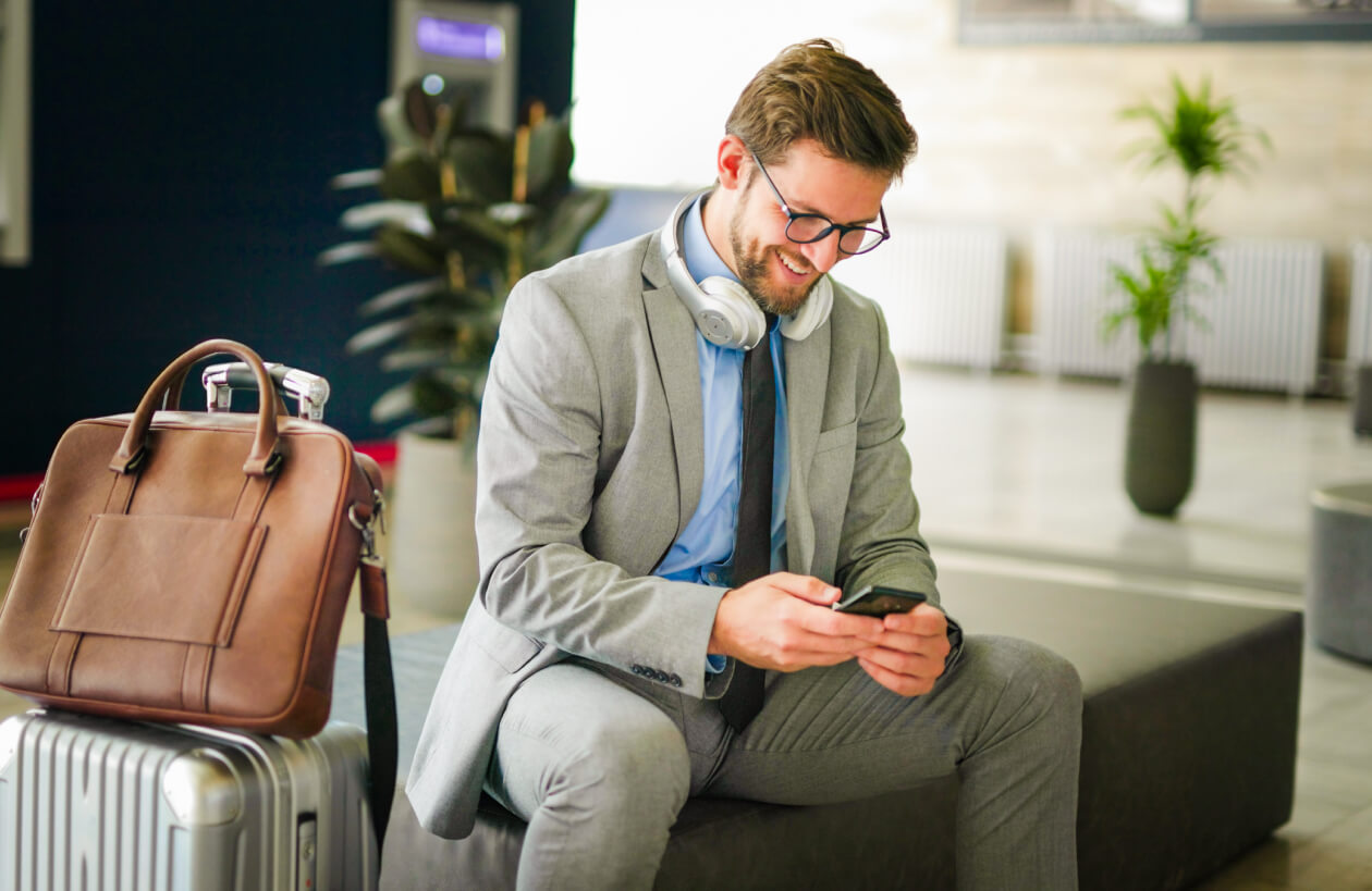 A professional man working abroad whilst on the Three Business network