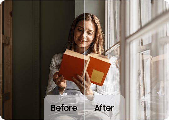 Woman reading next to a window