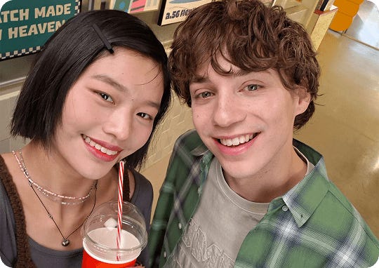Two people smiling in camera selfie