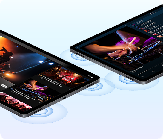 Two Galaxy Tab S12 Ultra devices placed lying down next to each other with videos of live concert performances playing in YouTube app on one device and YouTube Music app on the other. Sound waves are coming from the 4-channel audio system on both devices, showcasing the rich, immersive spatial sound users can experience from the 4-speaker audio system.