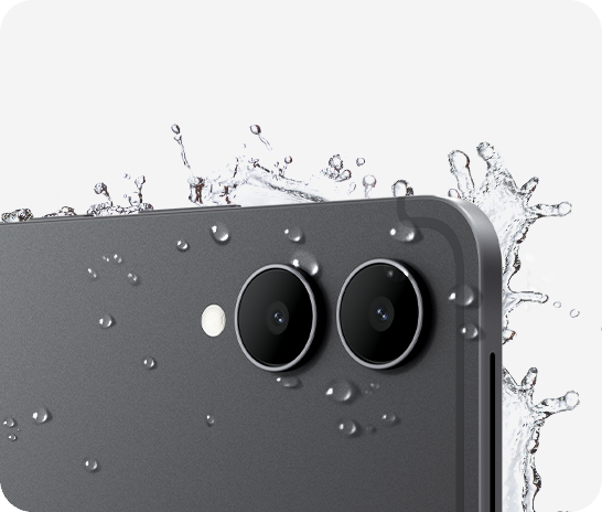 Close-up of the back of Galaxy Tab S12 Ultra with the rear cameras visible and splashes of water around the tablet, showcasing the IP68-rated protection against natural elements.