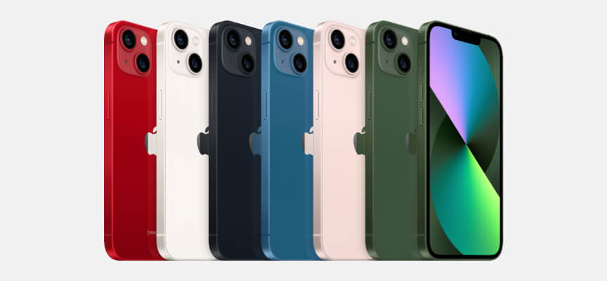 A row of 7 iPhone 13s in (PRODUCT)Red, Starlight, Midnight, Blue, Pink and two in Green.
